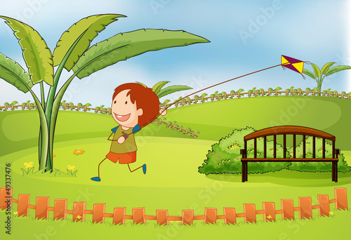 A boy playing kite