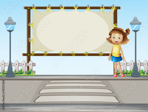 A girl standing along the road