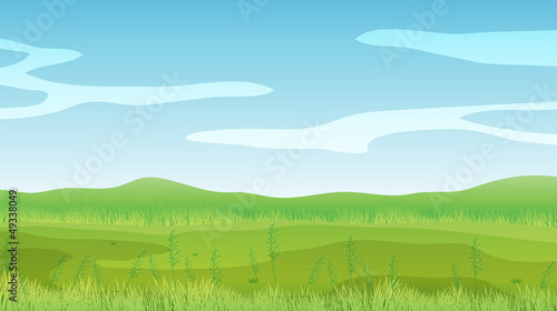 An empty field under a clear blue sky