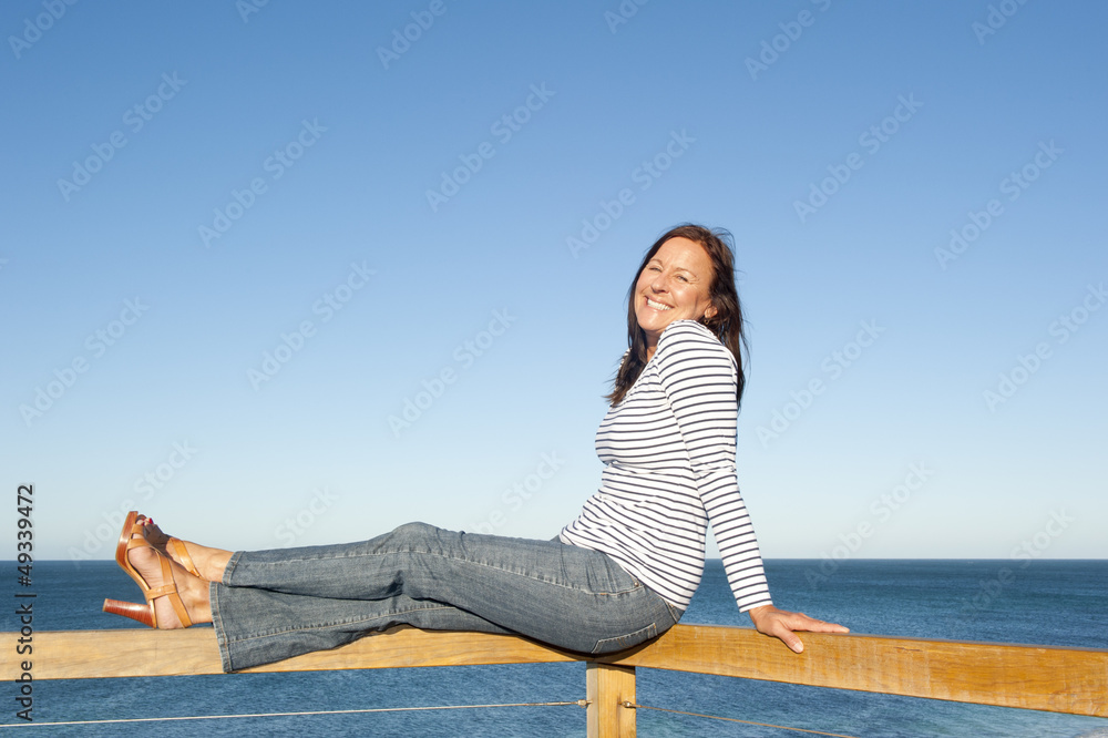 Attractive mature woman ocean background Attractive mature woman ocean background