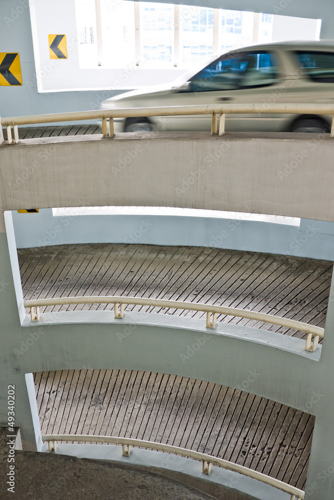 Fototapeta premium Car driving out of car park building