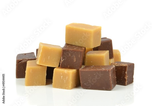 A pile of vanilla and chocolate fudge on a white background