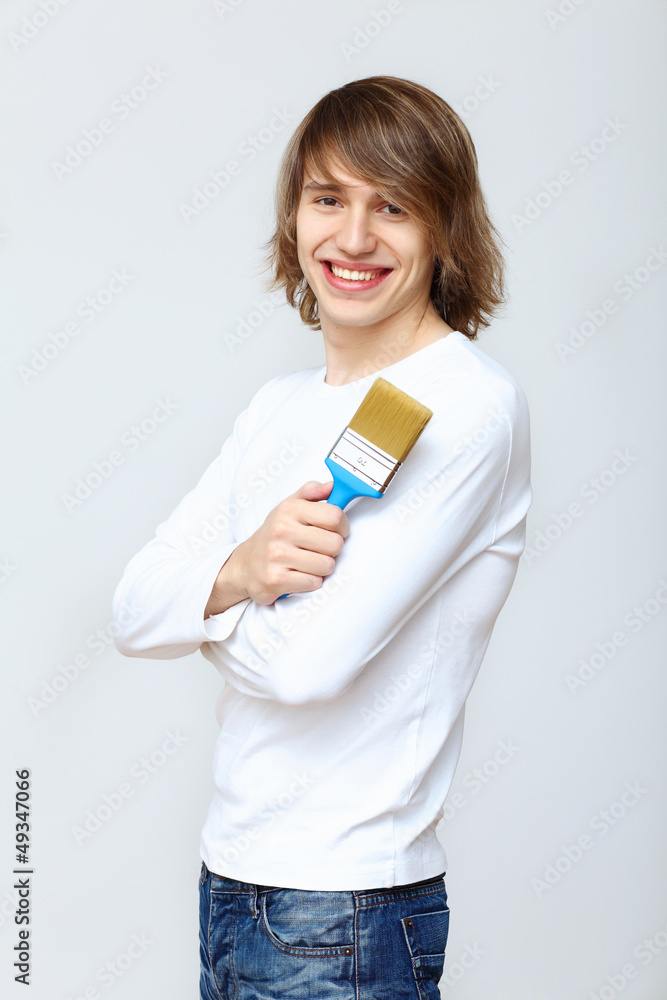 Man with paint brushes