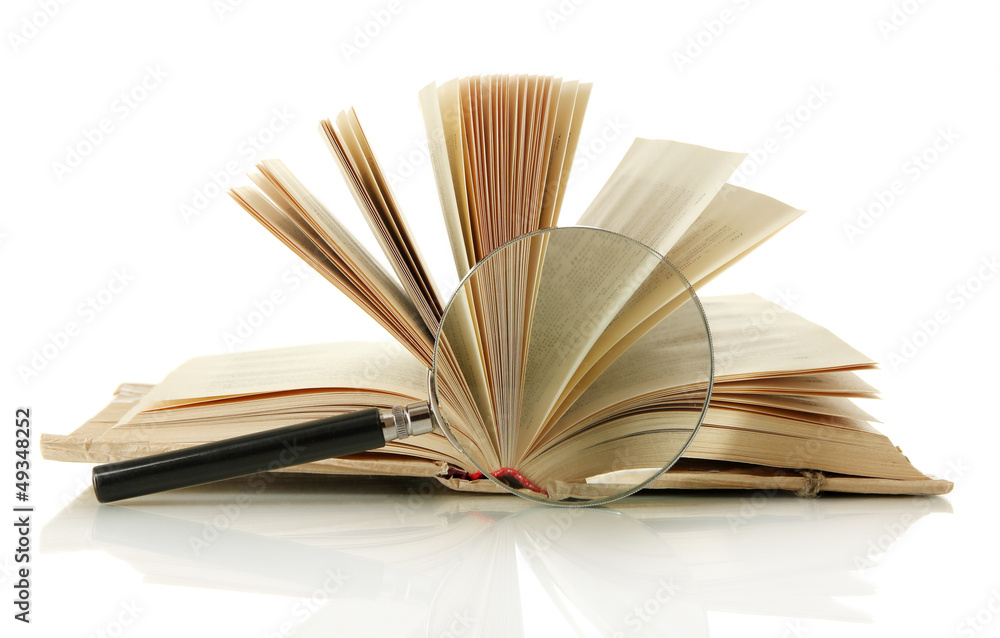Magnifying glass and open book isolated on white Magnifying glass and open book isolated on white