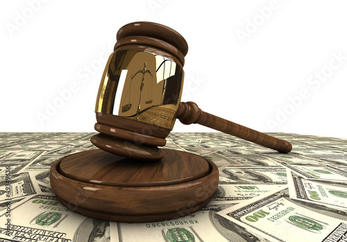 Judge's gavel standing on a dollars