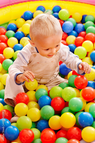 Child in colored ball.