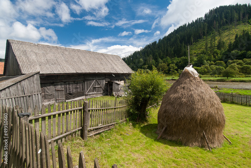 Traditional wooden farmhouse in Tranylvania, Romania photo