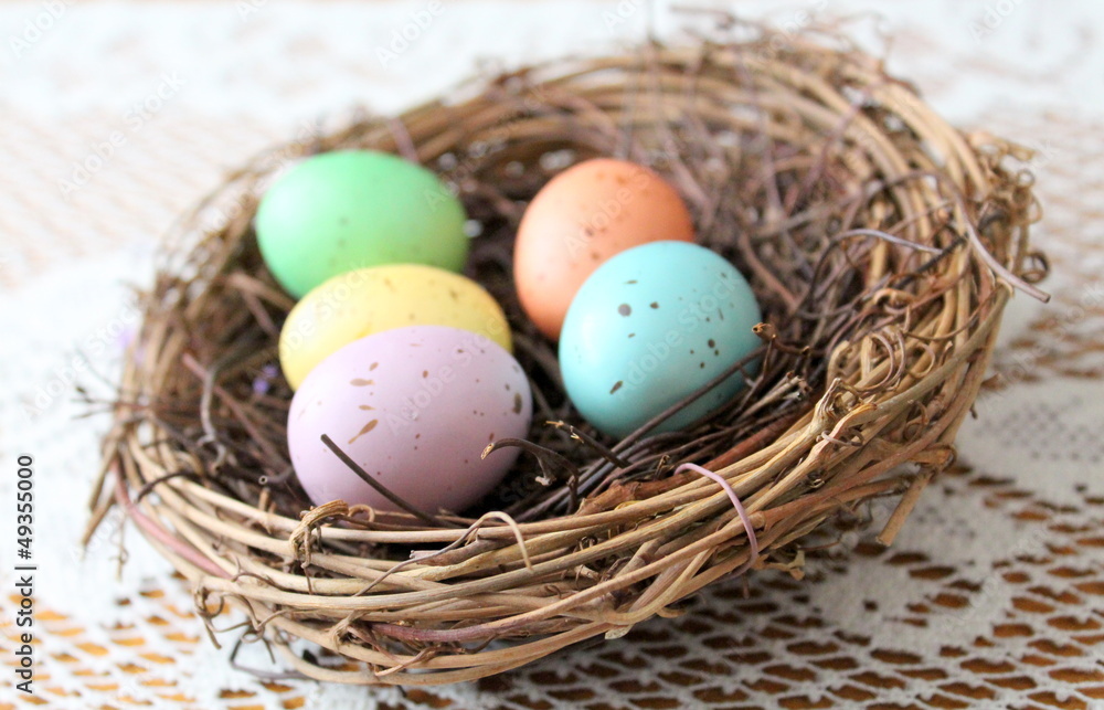 Twig nest with colorful easter eggs Twig nest with colorful easter eggs