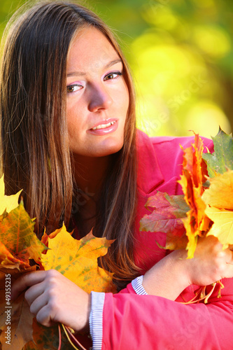 Autumn woman on leafs background