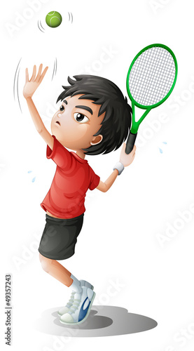 A boy playing tennis