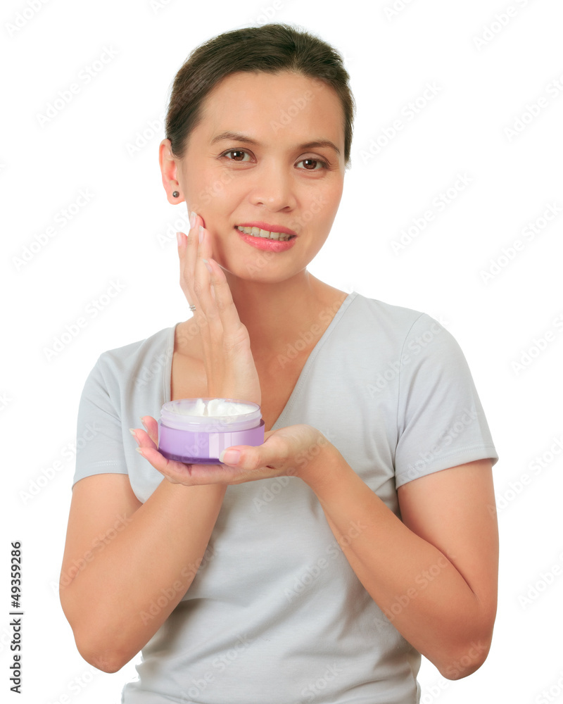 Isolated middle age asian woman with cosmetic cream Isolated middle age asian woman with cosmetic cream