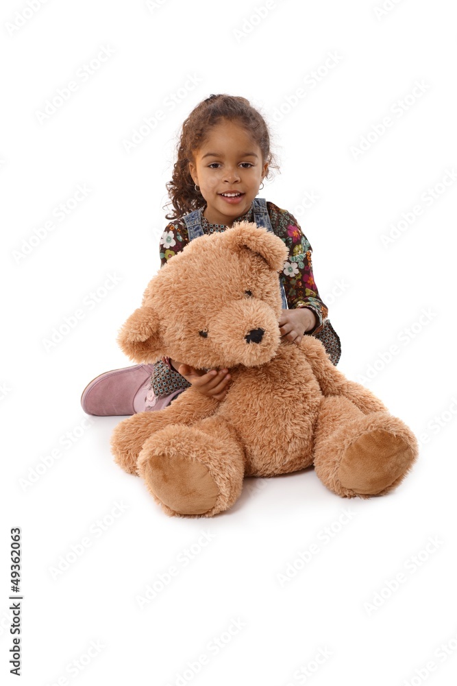 Beautiful little girl with huge plush bear Beautiful little girl with huge plush bear