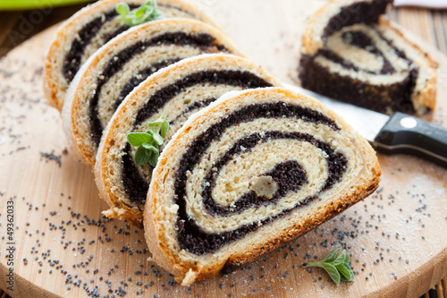 poppy seed Roll on a wooden surface photo