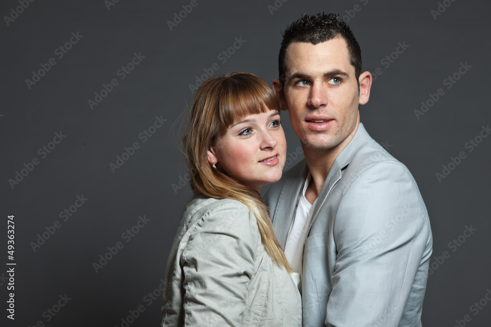 Young couple man and woman in love. Studio shot. Young couple man and woman in love. Studio shot.