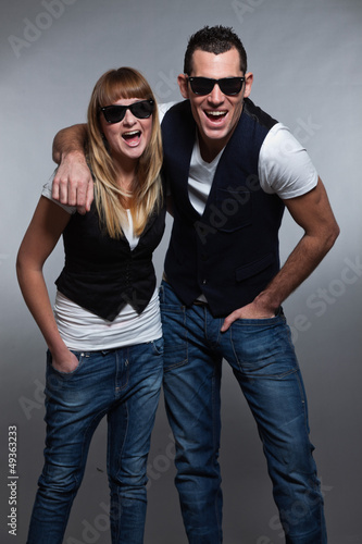 Young couple man and woman in love. Sunglasses. © ysbrandcosijn