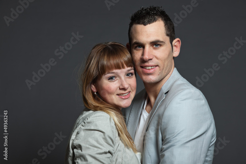 Young couple man and woman in love. Studio shot. © ysbrandcosijn