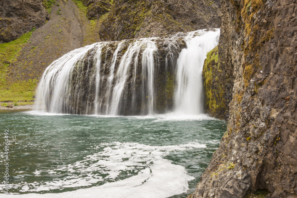 Fototapeta premium Mountain view - small cascade, Iceland.
