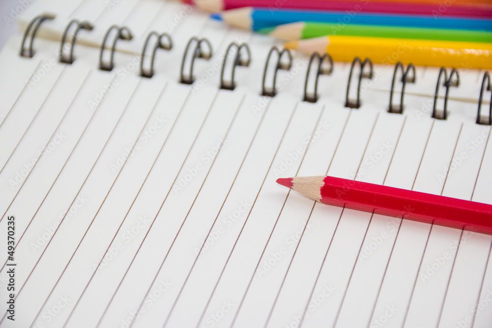 Colorful pencils and notebook Colorful pencils and notebook