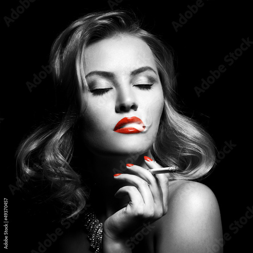 Retro Portrait Of Beautiful Woman With Cigarette