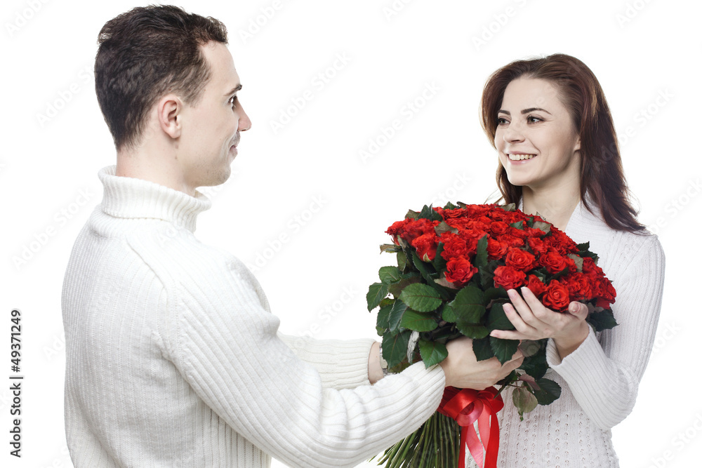 happy couple with bouquet of red roses isolated on white happy couple with bouquet of red roses isolated on white