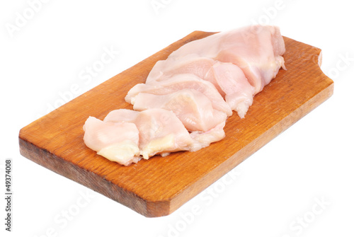 chicken meat sliced on cutting board isolated on white
