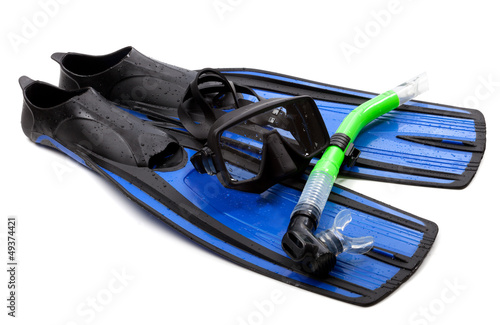 Mask, snorkel and flippers with water drops. Diving gear on whit