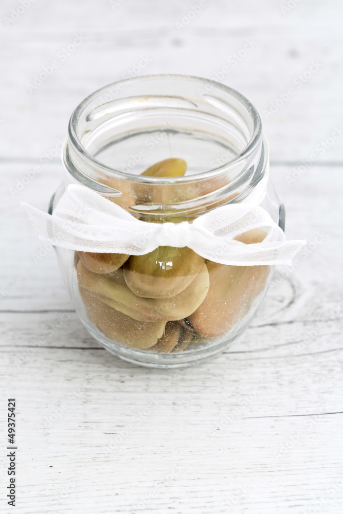 Beans in glass jar on wooden background Beans in glass jar on wooden background