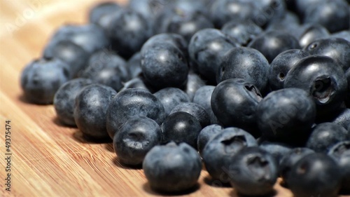 Wallpaper Mural Rotating Blueberries on a wooden plate Torontodigital.ca