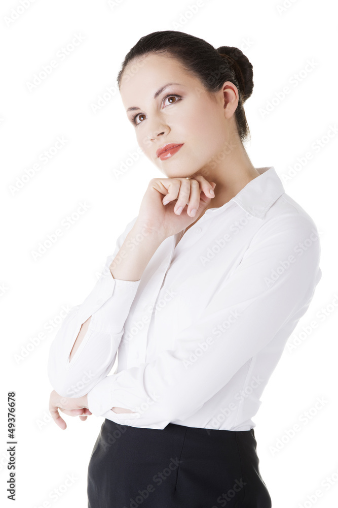 Young thoughtful businesswoman looking on side Young thoughtful businesswoman looking on side
