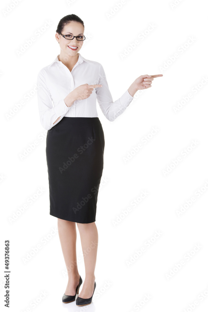 Happy young business woman showing copy space Happy young business woman showing copy space