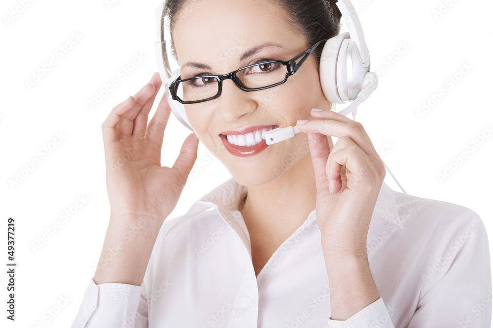 Beautiful young call-center assistant smiling Beautiful young call-center assistant smiling