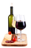 two wine glasses with red and white wine and bottle of wine