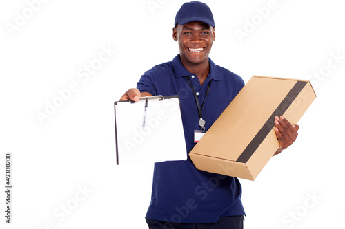 african american delivery man carrying parcel photo