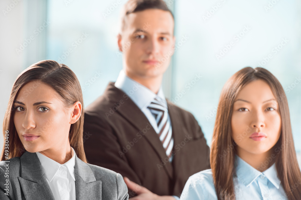 Portrait of an attractive young business group standing together Portrait of an attractive young business group standing together
