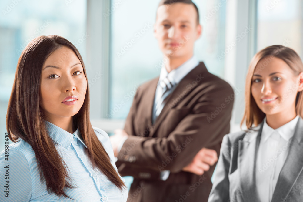 Portrait of an attractive young business group standing together Portrait of an attractive young business group standing together