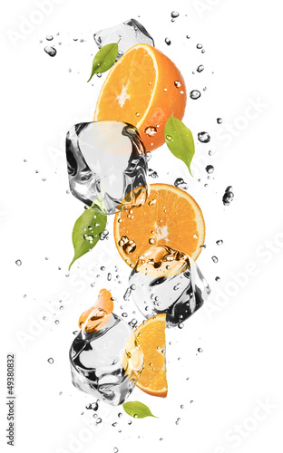 Oranges with ice cubes, isolated on white background