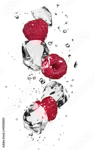 Raspberries with ice cubes, isolated on white background
