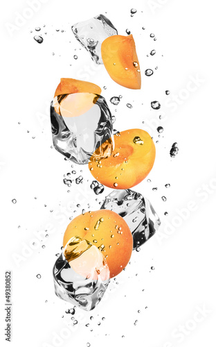 Apricots with ice cubes, isolated on white background