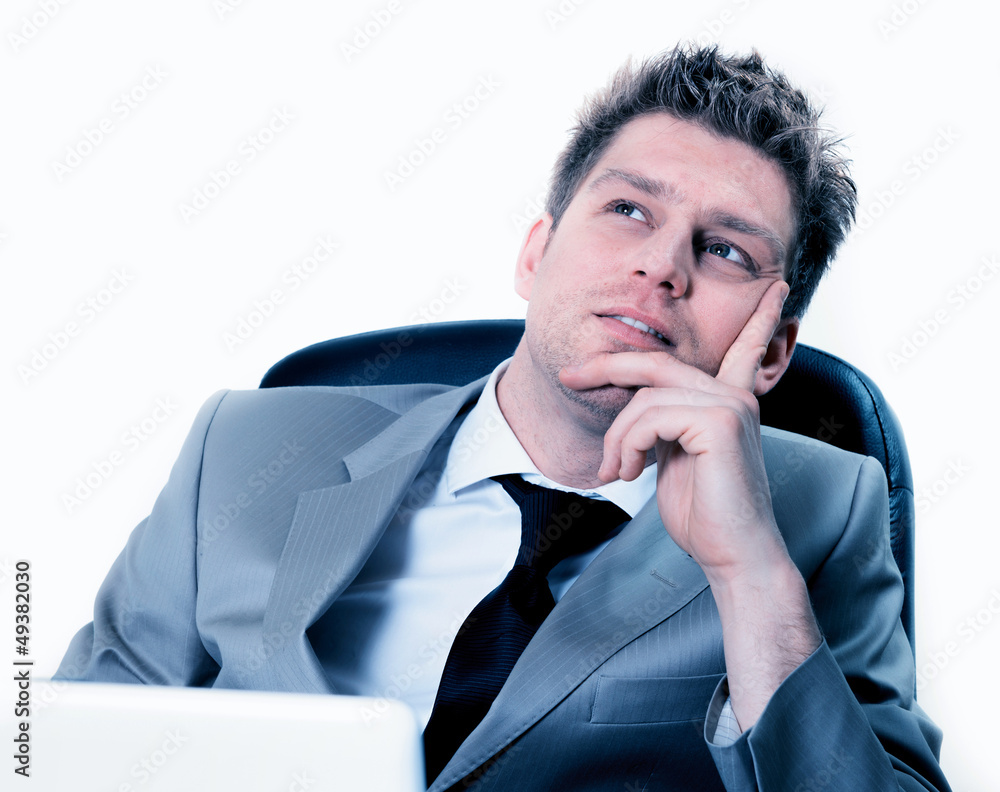 portrait of businessman dreaming or thinking at work portrait of businessman dreaming or thinking at work