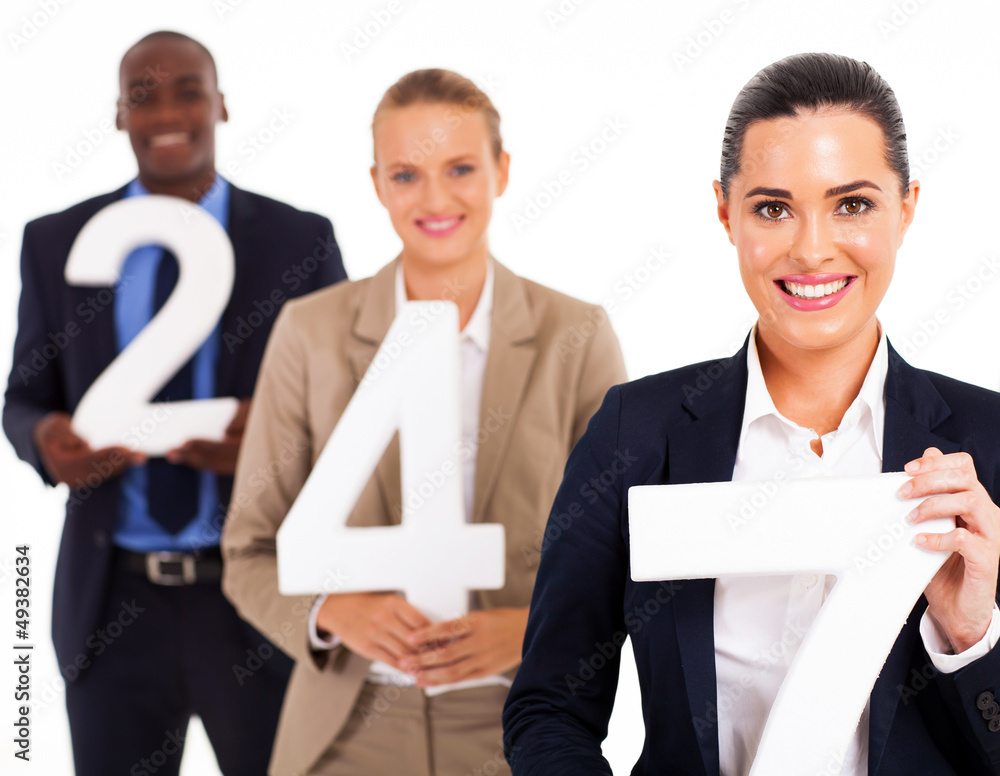 group of business people holding numbers 24 7 group of business people holding numbers 24 7