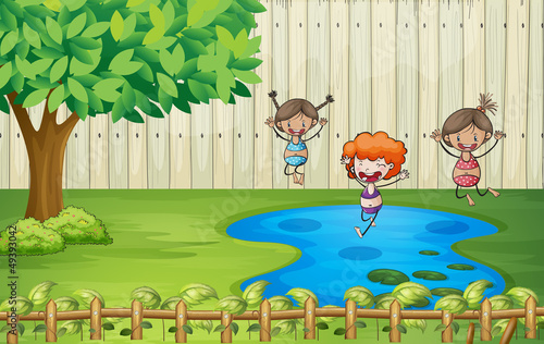 Girls swimming in a pond