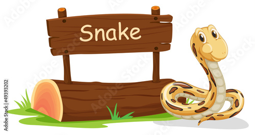 A snake beside a signboard