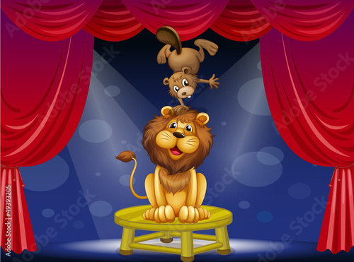 A lion and a beaver performing on the stage