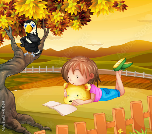A girl studying outside