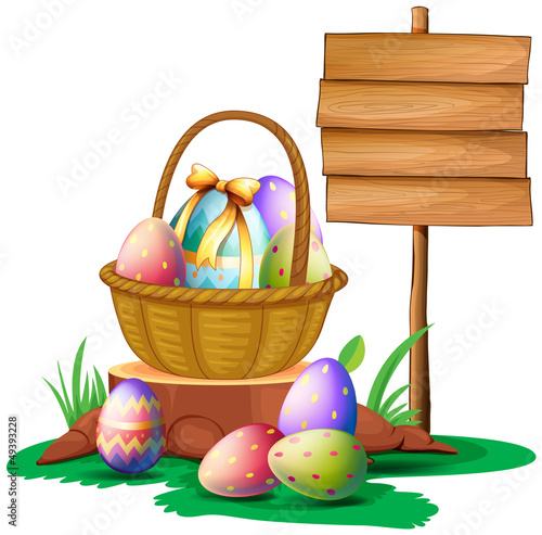 Easter eggs near a wooden signboard