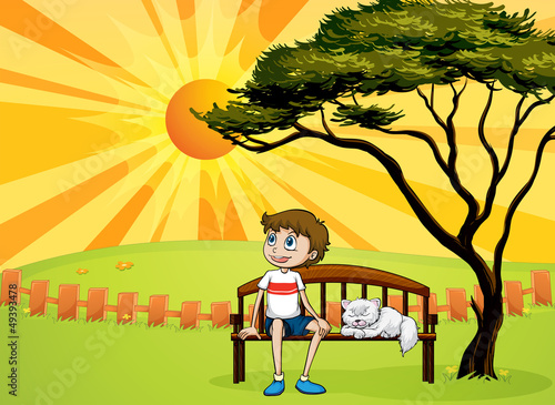 A boy and a cat sitting on a bench