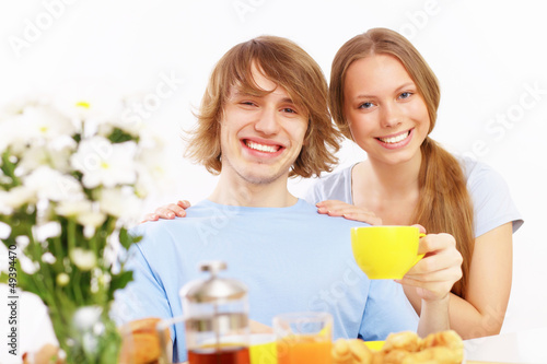 Couple at home drinking tea