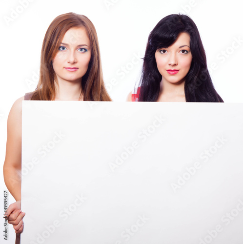 Two girls with banner.