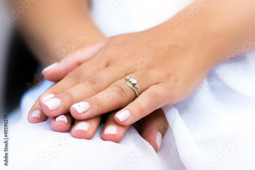 Wedding ring with stone on bride hand