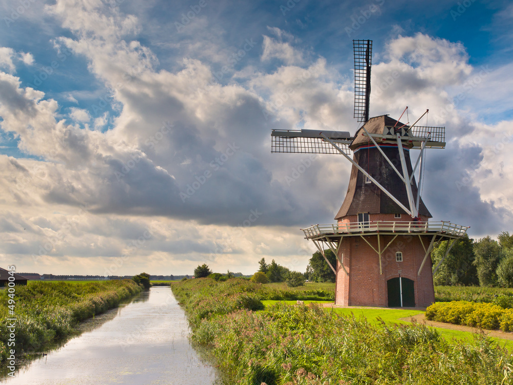 Dutch Windmill besides a Canal Dutch Windmill besides a Canal